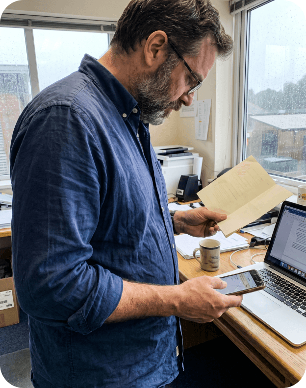 Scanning a paper document at a desk